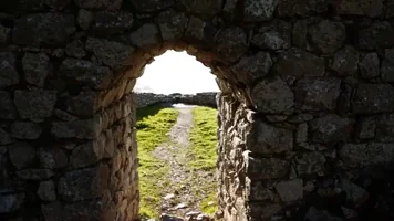 passing through a stone brick doorway