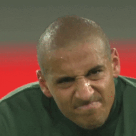 Wincing reaction gif