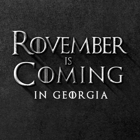 Text gif. In gray Game of Thrones font against a stony black background reads the message, “Rovember is Coming in Georgia.”
