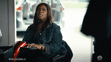 TV gif. Retta as Ruby, Mae Whitman as Annie and Christina Hendricks as Beth in Good Girls all stare blankly and in shock. 