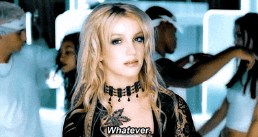 Music video gif. From the video for Stronger, Britney Spears looks at us and shakes her head and says "whatever," which appears as text.