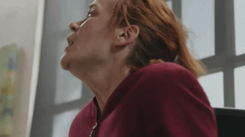 women sneezing due to seasonal allergies
