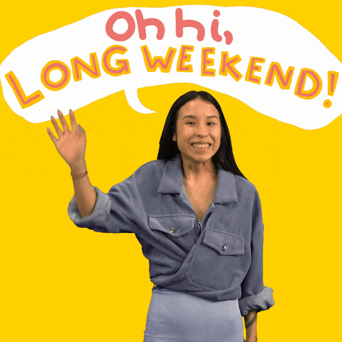 Digital art gif. Woman wearing a grey button-down shirt leans forward slightly, smiling widely and waving at us against a bright yellow background. Text in a speech bubble above her head says, "Oh hi, long weekend!"