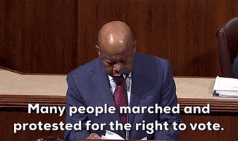 Political gif. John Lewis references speech papers as he speaks into a microphone at a podium in congress. Text, "Many people marched and protested for the right to vote." 