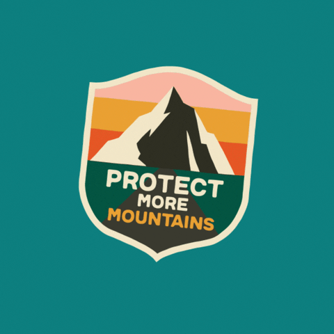Digital art gif. Large sticker lifts one edge and puts it back down on a dark blue background; the sticker shows an image of a large mountain against an orange, pink and yellow sunset with the text "Protect more mountains."
