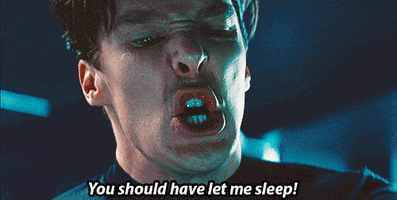 Movie gif. Benedict Cumberbatch as Khan in Star Trek Into Darkness looks down with pure rage in his face as he says, “You should have let me sleep!”