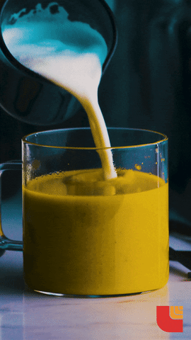 healing herb tumeric being made into a latte