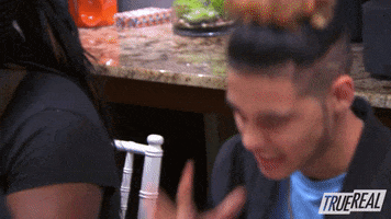 Reality TV gif. Contestant on The Rap Game makes an extremely tight cringe face in response to something.