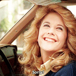 Movie gif. Meg Ryan as Sally in Harry Met Sally. She smiles boldly and openly and says, "Sorry," while scrunching her eyes cutely.