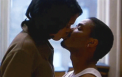 Movie gif. Nia Long and Larenz Tate as Nina and Darius in Love Jones sharing a long, passionate kiss.