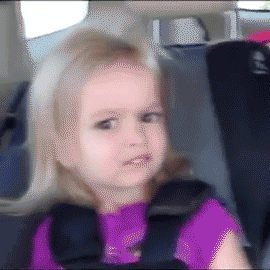Video gif. A little blonde girl wearing a pink shirt is strapped into a car seat in the back seat of a car. She looks at us with a confused, somewhat disgusted expression. She clearly disapproves of something--disapproves a lot. 