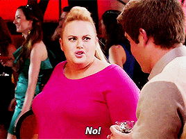 Movie gif. Rebel Wilson as Fat Amy and Adam DeVine as Bumper in Pitch Perfect 2. She looks at him with disgust and adamantly says, "No!" but then turns around again slightly to give him an innuendo filled wink.
