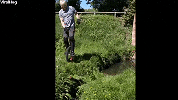 Man Trying To Jump Small Stream On Unicycle Prevails GIF by ViralHog