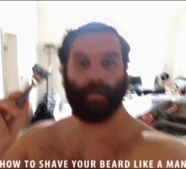 man shaves GIF
