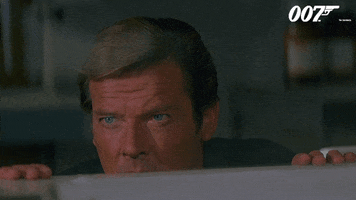 Spying Roger Moore GIF by James Bond 007