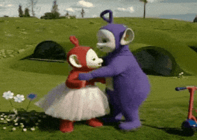 TV gif. Po and Tinky Winky from the Teletubbies hug each other. Po is wearing a ballerina skirt and they hug on their lush green hill.
