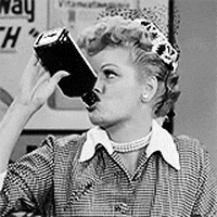 TV gif. Lucille Ball downing the contents of a liquor bottle.
