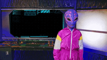Video gif. An alien is in a spaceship and looks back at their screen which reads, "Happy Friday!" Their jaw opens in surprise and they jump, throwing jazz hands into the air.