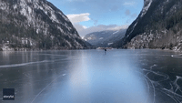 Man Travels Mary Poppins-Style Across Frozen Lake