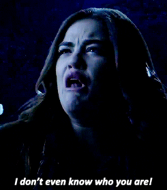 TV gif. Lucy Hale as Aria in Pretty Little Liars cries, “I don't even know who you are!”