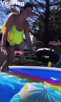 Woman Slides Straight Across Pool on Raft