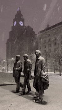 Snow Falls Over Beatles Statue on Liverpool Waterfront