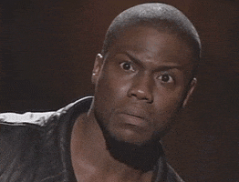 Video gif. Actor and comedian Kevin Hart looks at us and blinks his wide eyes slowly, his face an expression of confusion and concern at something he's just heard or witnessed.