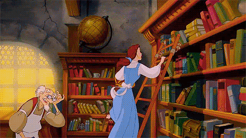 Belle slides across the bookstore shelf on a ladder
