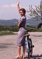 waving brigitte bardot GIF