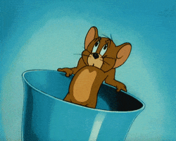 TV gif. Jerry from Tom and Jerry has been cornered in a teacup. His heart beats out of his chest, and when he casually pushes it back in, it pops out on the other side.