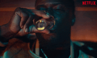 TV gif. Supercut of Kevin Hart as Kid in True Story and other cast members pouring drinks, downing drinks, and clinking glasses.