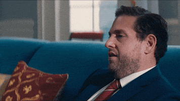 Movie gif. Jonah Hill as Jason in Don't Look Up rolls his eyes and drops his head back as if stressed on the couch. 