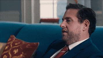 Movie gif. Jonah Hill as Jason in Don't Look Up rolls his eyes and drops his head back as if stressed on the couch. 
