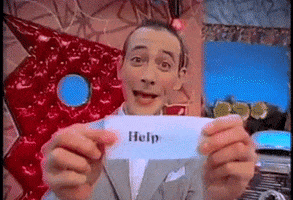 TV gif. Paul Reubens as Pee Wee Herman on Pee Wee's Playhouse smiles happily as he holds out a piece of paper. It reads, "Help". 
