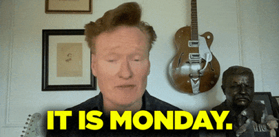 Late Night gif. Conan O'Brien on Conan sits in his house with a guitar on the wall and a metal bust behind him. He looks at us with a serious expression and says, “It is Monday.”