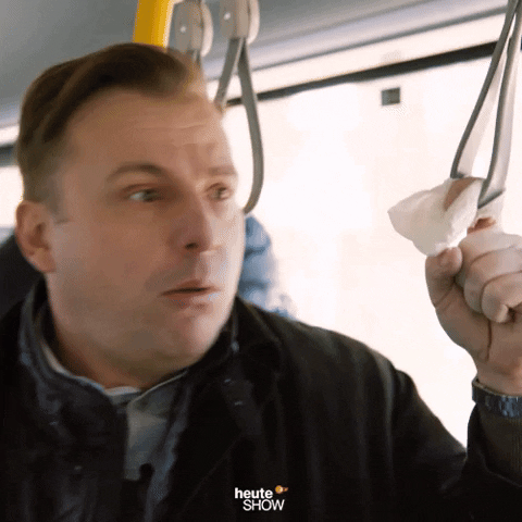 TV gif. Martin Klempnow from Heute Show is on a bus and is pretending to gag in disgust. 