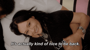 TV gif. Shannen Doherty as Brenda in 90210 smiles up at the camera and says, “It’s actually kinda nice to be back.”