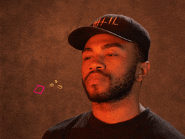 Celebrity gif. Kevin Abstract of Brockhampton does a chef's kiss, touching his fingers to his lips and pulling them away, as animated confetti appears.
