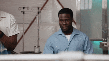 TV gif. Kevin Hart on Real Husbands of Hollywood says "I'm nervous," then smiles and laughs, covering his mouth with a fist and then looking deeply worried.