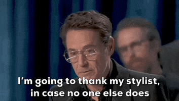 Oscars 2024 gif. Robert Downey Jr wins Best Supporting Actor. He stares at the crowd intensely through his glasses and scrunches up his nose in concentration while saying, "I'm going to thank my stylist, in case no one else does."