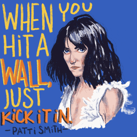 Digital art gif. Somber Patti Smith blinks at us against a blue background. Text, “When you hit a wall, just kick it in - Patti Smith.”
