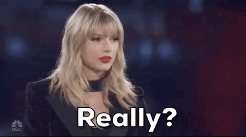 Reality TV gif. Taylor Swift steps forward eagerly. Text, "Really?"