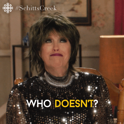 Schitt's Creek gif. Catherine O'Hara as Moira in a shimmery dress shakes her head and shrugs, saying, "who doesn't?"