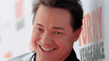 Digital art gif. Still image of a smiling Brendan Fraser, his eyebrows moving up and down on his face strangely and suggestively.