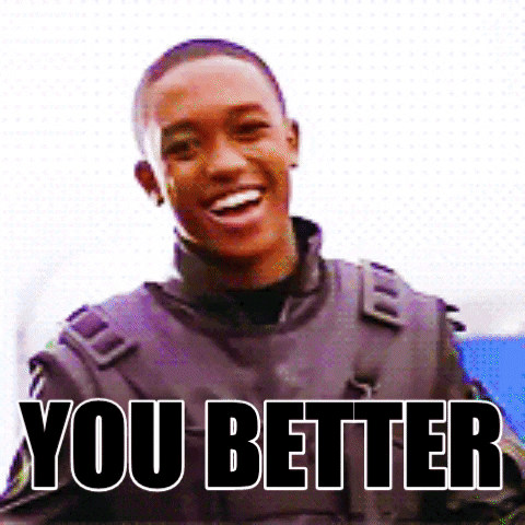 Disney gif. A young man is grinning on stage and points at us happily. Text, "You better."