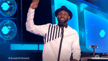 Celebrity gif. Stephen Boss, also known as tWitch, is hosting a segment on The Ellen DeGeneres Show and he looks up at the crowd while waving joyfully.