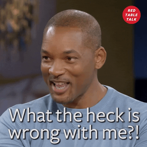 Video gif. Will Smith sits for a Red Table Talk discussion and smiles, looking around the room as he says, "What the heck is wrong with me?"