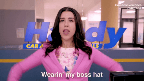 An anitmed gif video clip from the TV show Kim's Convenience. It has a woman wearing a pink suit saying "wearing my boss hat" while she mimes putting a hat on her head.