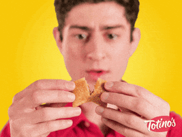 Ad gif. Young man pulls a Totino's pizza roll in half, a small whiff of steam escapes, and the boy says, impressed, "whoa, hot."