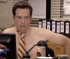 Andy wearing nothing but a tie looks incredulously at Stanley